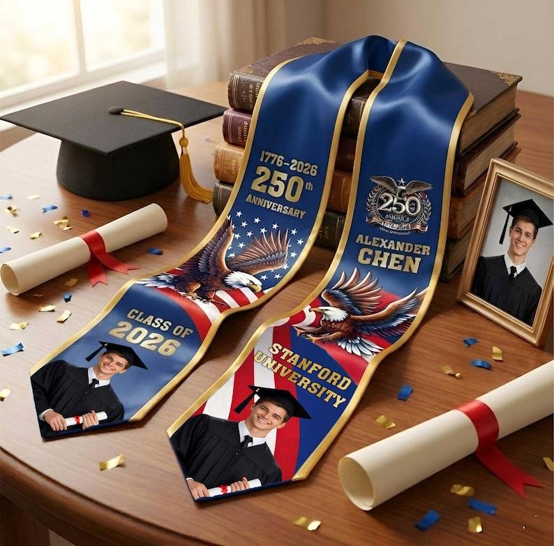 May include: Two blue graduation stoles with gold trim, featuring an American flag design and an eagle. One reads 